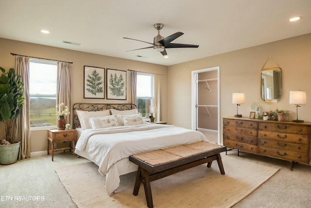 bedroom featuring recessed lighting, visible vents, light carpet, and baseboards