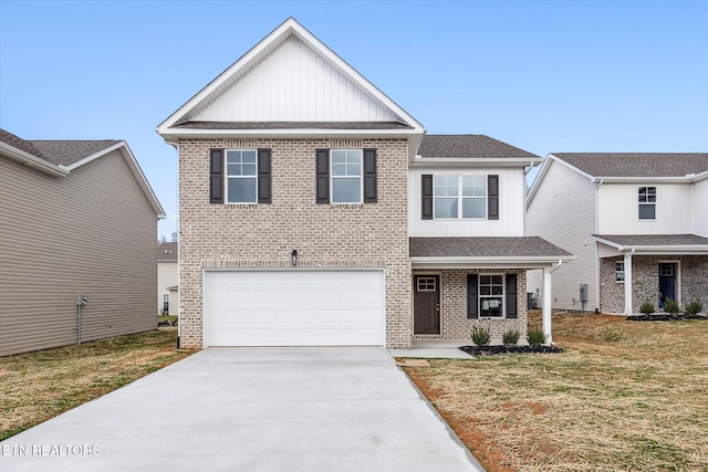 view of front of house featuring a front lawn and a garage