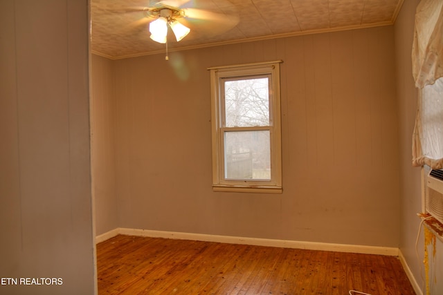 spare room featuring ceiling fan, crown molding, and hardwood / wood-style flooring