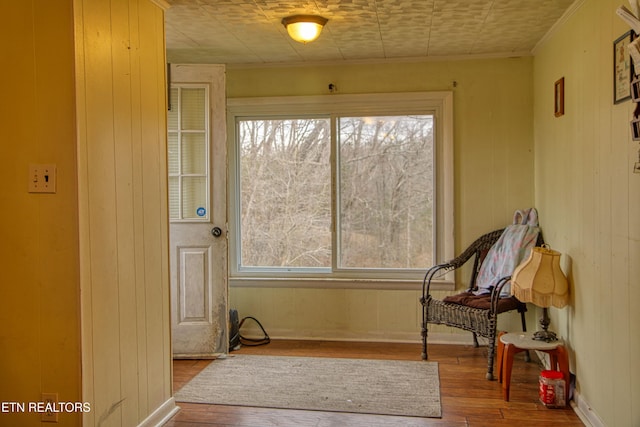 living area with hardwood / wood-style flooring