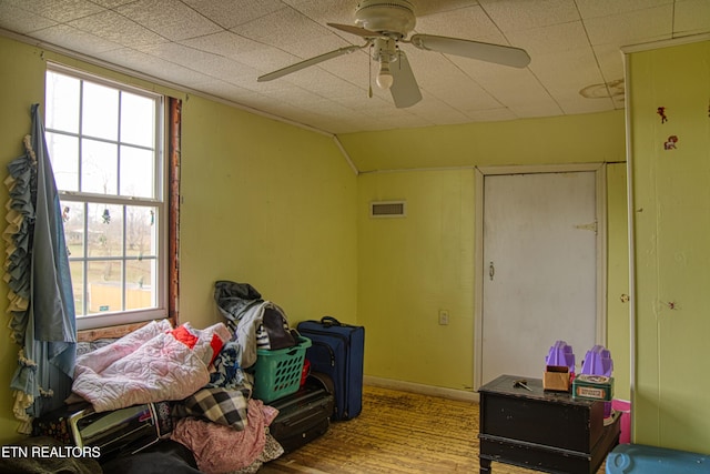 miscellaneous room featuring hardwood / wood-style flooring, ceiling fan, and lofted ceiling