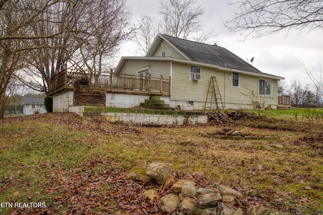 view of home's exterior featuring a deck