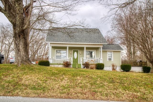 bungalow-style home featuring a front lawn and a porch