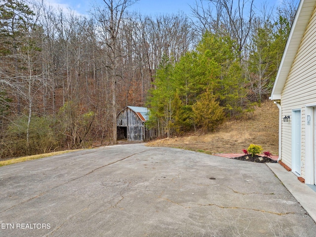 view of patio / terrace featuring a storage shed