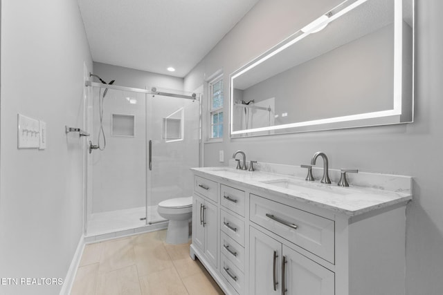 bathroom featuring walk in shower, vanity, and toilet