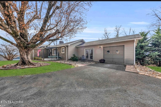 single story home with a garage