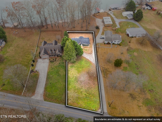 birds eye view of property with a rural view