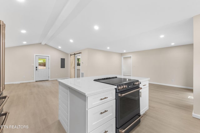 kitchen with light wood-type flooring, range with electric cooktop, lofted ceiling with beams, a barn door, and white cabinetry