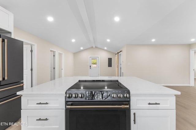 kitchen featuring light stone countertops, vaulted ceiling with beams, light hardwood / wood-style floors, white cabinets, and appliances with stainless steel finishes