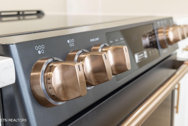 interior details featuring stainless steel range with electric stovetop