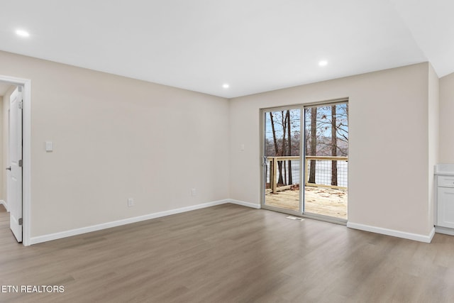 empty room with light wood-type flooring