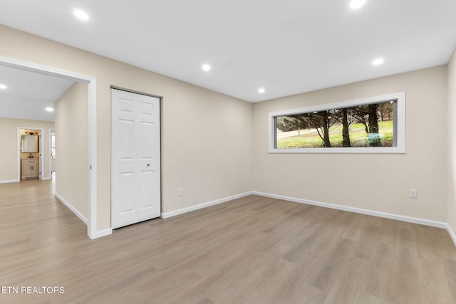 unfurnished room with light hardwood / wood-style flooring