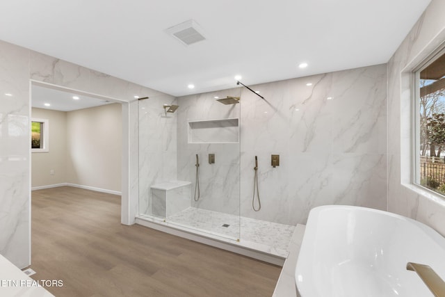 bathroom with separate shower and tub and hardwood / wood-style floors