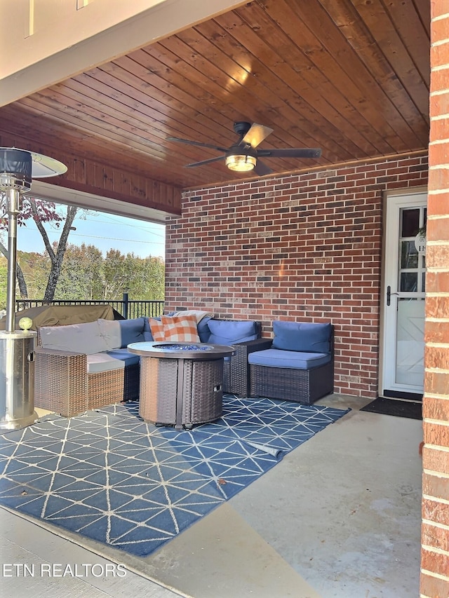 view of patio with outdoor lounge area and ceiling fan