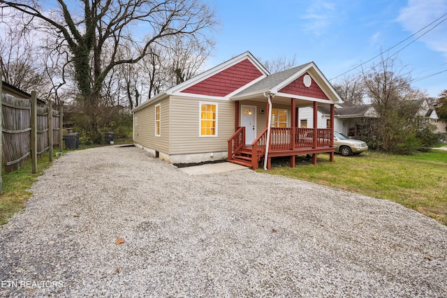 bungalow featuring a porch and a front yard