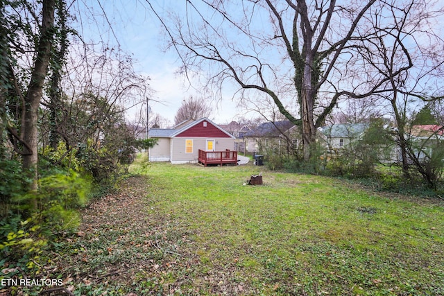 view of yard featuring a wooden deck