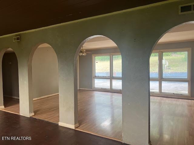 empty room featuring hardwood / wood-style flooring and ceiling fan