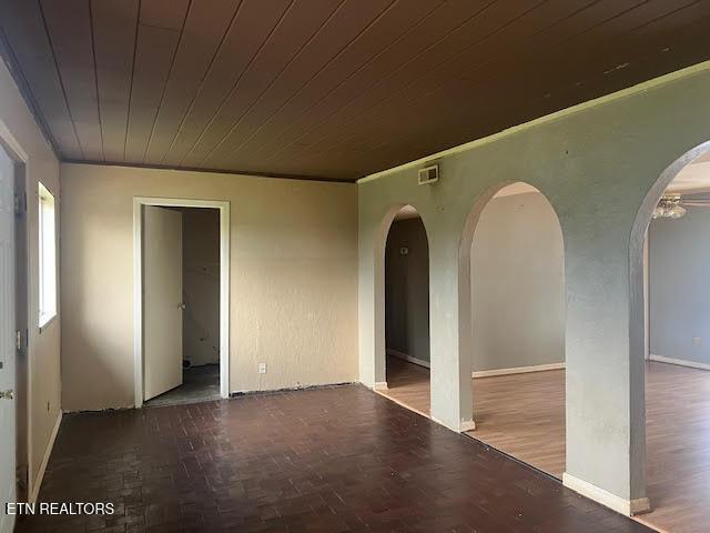 spare room featuring wooden ceiling