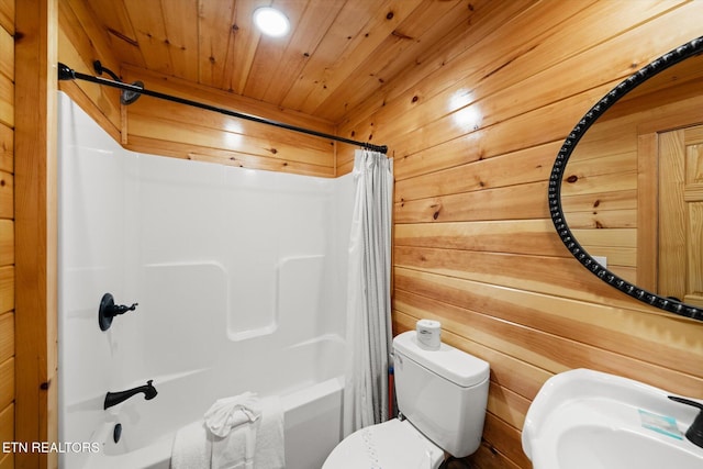 full bathroom featuring shower / bath combo with shower curtain, sink, wooden walls, and wooden ceiling