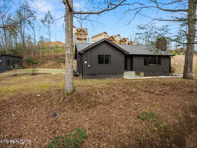 rear view of property featuring central AC unit