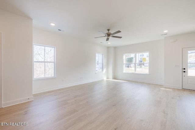 spare room with ceiling fan and light hardwood / wood-style floors