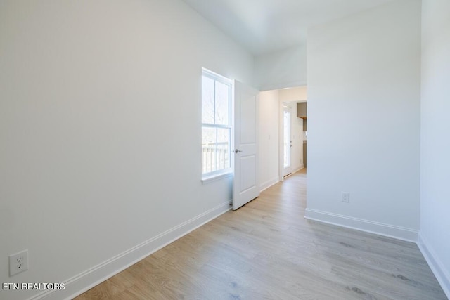 spare room with light hardwood / wood-style floors