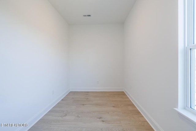 spare room with light hardwood / wood-style floors