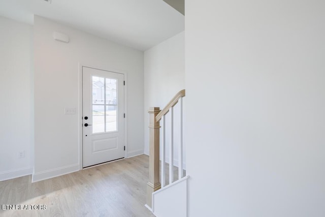 foyer with light hardwood / wood-style flooring