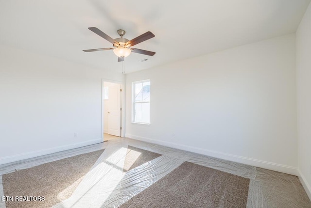 unfurnished room with ceiling fan