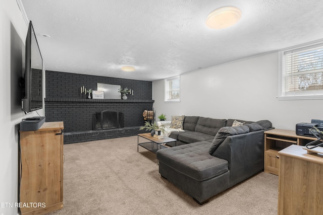 carpeted living room featuring a textured ceiling and a fireplace