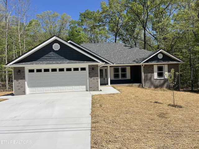 150 Hunterwood Ln, Fairfield Glade, TN 38558 - ranch-style home with driveway, an attached garage, a shingled roof, and brick siding