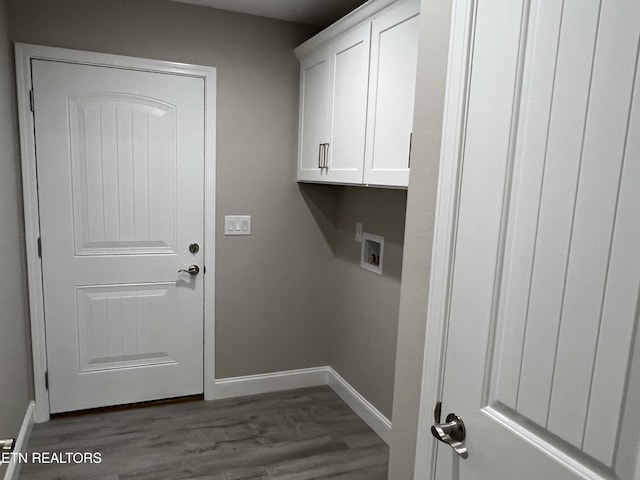 150 Hunterwood Ln, Fairfield Glade, TN 38558 - clothes washing area featuring dark wood-style floors, hookup for a washing machine, cabinet space, and baseboards