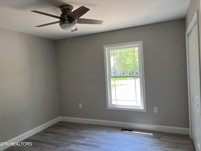 150 Hunterwood Ln, Fairfield Glade, TN 38558 - spare room with visible vents, ceiling fan, wood finished floors, and baseboards