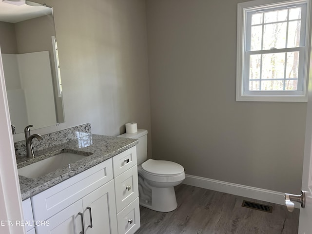 150 Hunterwood Ln, Fairfield Glade, TN 38558 - bathroom featuring visible vents, wood finished floors, a healthy amount of sunlight, and toilet