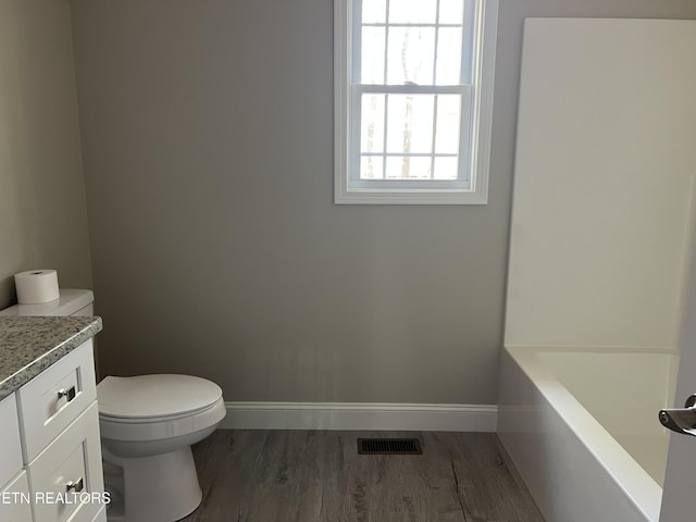 150 Hunterwood Ln, Fairfield Glade, TN 38558 - bathroom featuring wood finished floors, visible vents, toilet, and baseboards