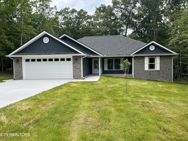 150 Hunterwood Ln, Fairfield Glade, TN 38558 - ranch-style home featuring concrete driveway, an attached garage, a front yard, and brick siding