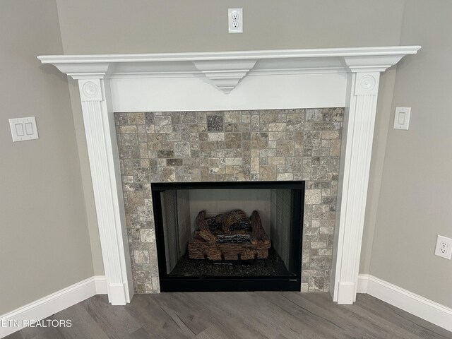 150 Hunterwood Ln, Fairfield Glade, TN 38558 - detailed view of a fireplace, baseboards, and wood finished floors
