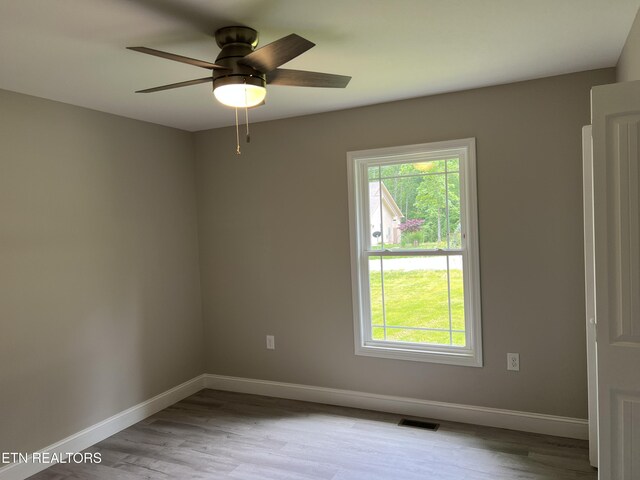 150 Hunterwood Ln, Fairfield Glade, TN 38558 - spare room with wood finished floors, baseboards, and a ceiling fan