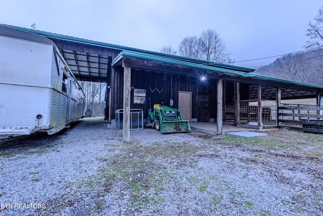 rear view of house with an outdoor structure