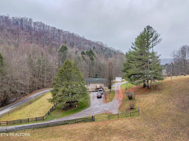 birds eye view of property featuring a mountain view and a rural view