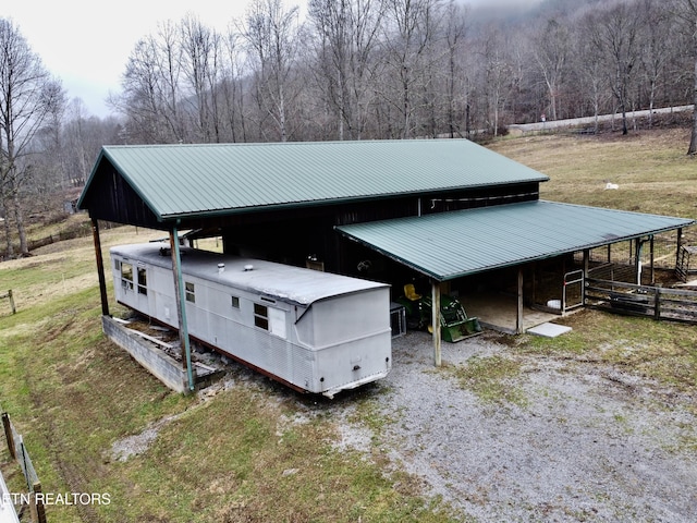 view of side of home with an outbuilding