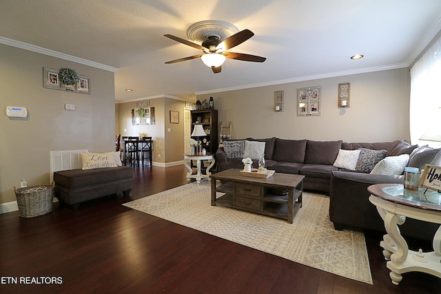 living room with wood-type flooring, ceiling fan, and crown molding