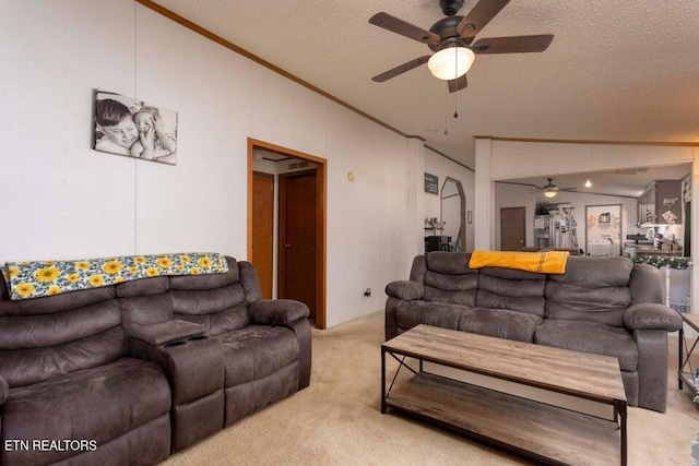 carpeted living room with a textured ceiling, ceiling fan, and lofted ceiling