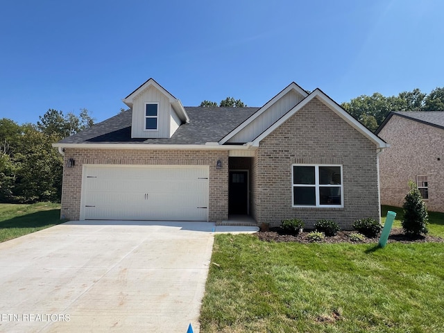 view of front of house with a front lawn and a garage