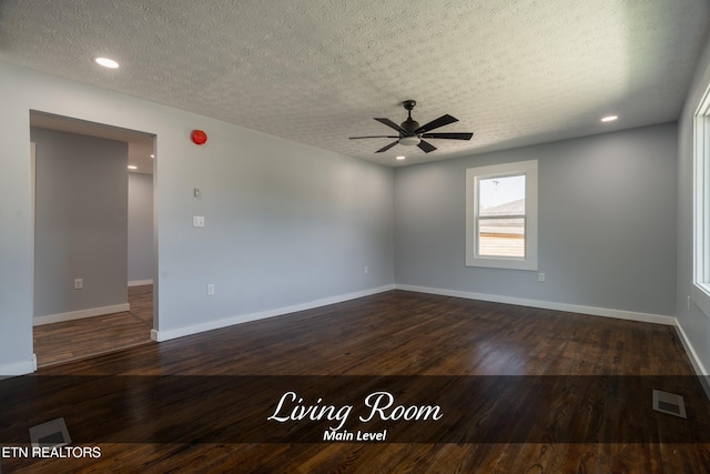 unfurnished room featuring ceiling fan, dark hardwood / wood-style floors, and a textured ceiling