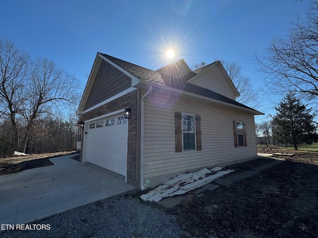 view of side of home with a garage