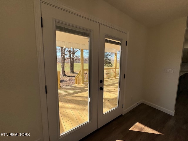 entryway featuring dark hardwood / wood-style flooring and french doors