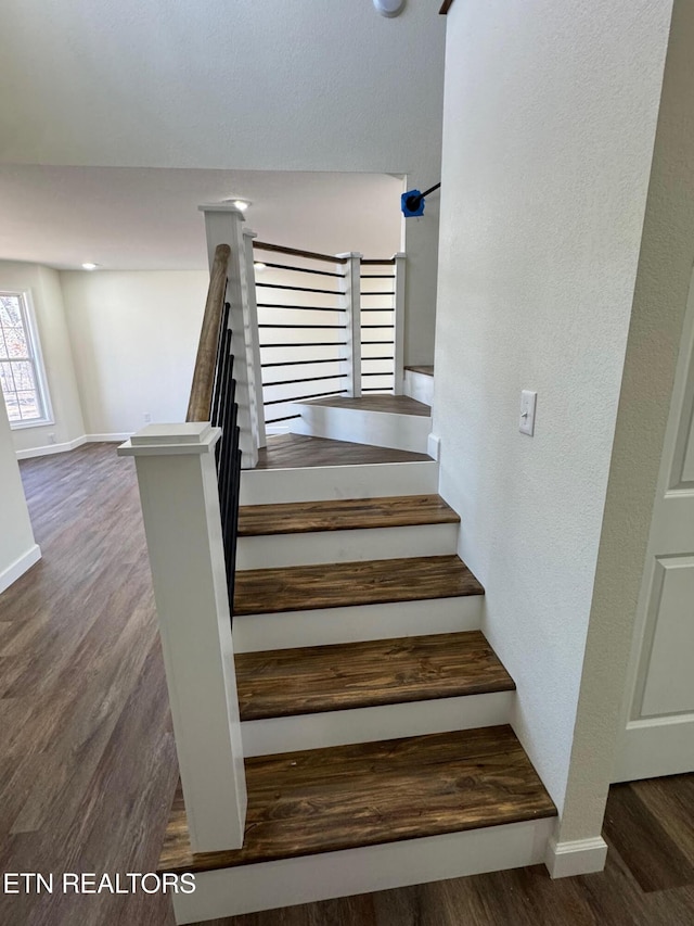 stairs with wood-type flooring