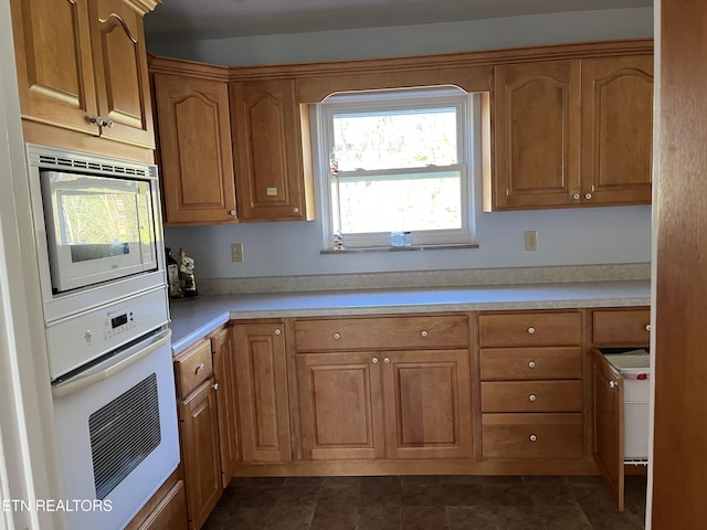 kitchen with stainless steel microwave and oven