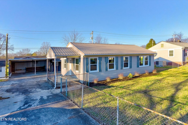 ranch-style home with a front yard and a carport